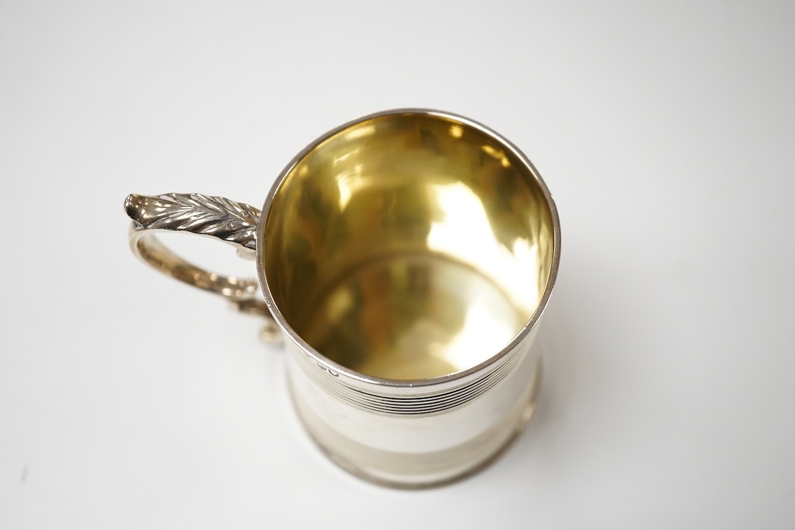 A William IV reeded silver christening mug, with later engraved initials and date to the base, Joseph Angell I & John Angell I, London, 1834, height 77mm, 3.9oz.